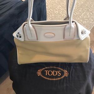 Tods leather handbag beige and gold 350 like new